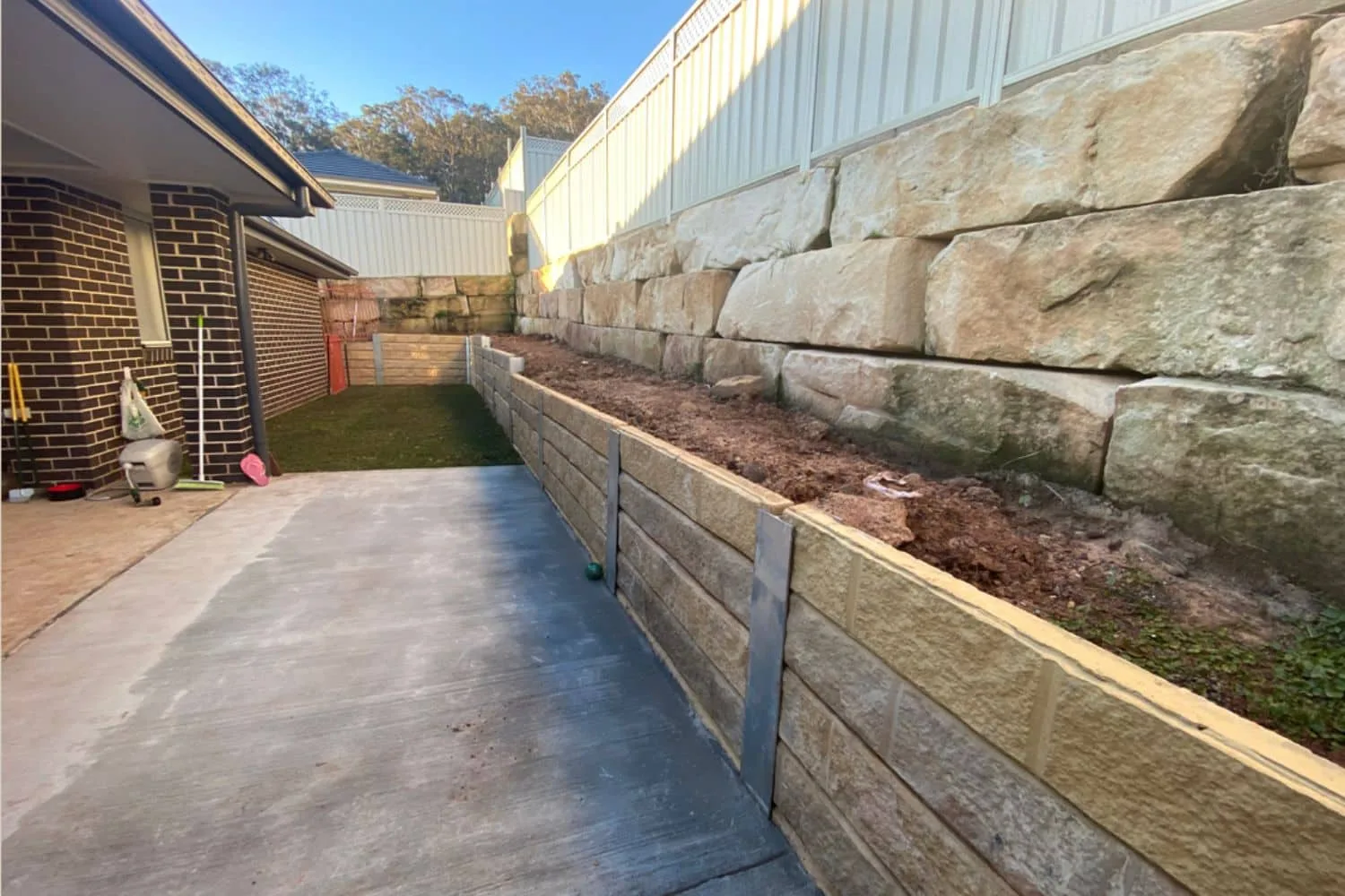 Concrete sleeper retaining wall installed on a Moreton Bay property