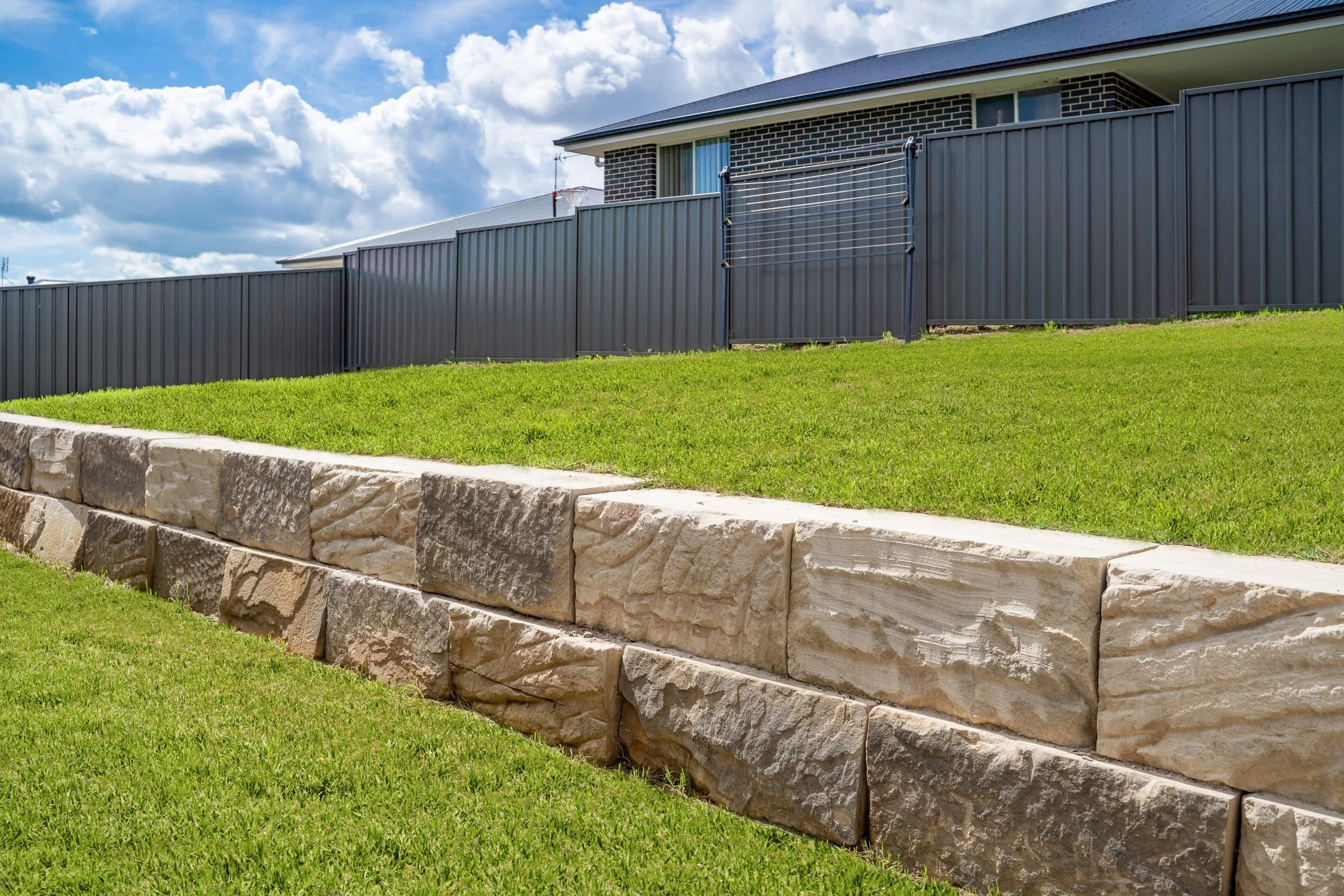 Sandstone retaining wall built on a Moreton Bay property